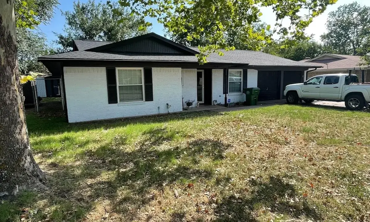 Professional roofing crew working on a residential roof in Danville